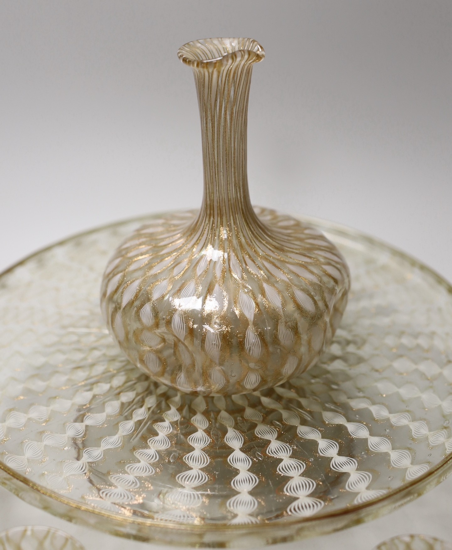 An Italian Salviati latticino and aventurine glass apperitif set, pedestal tray, seven glasses and a carafe